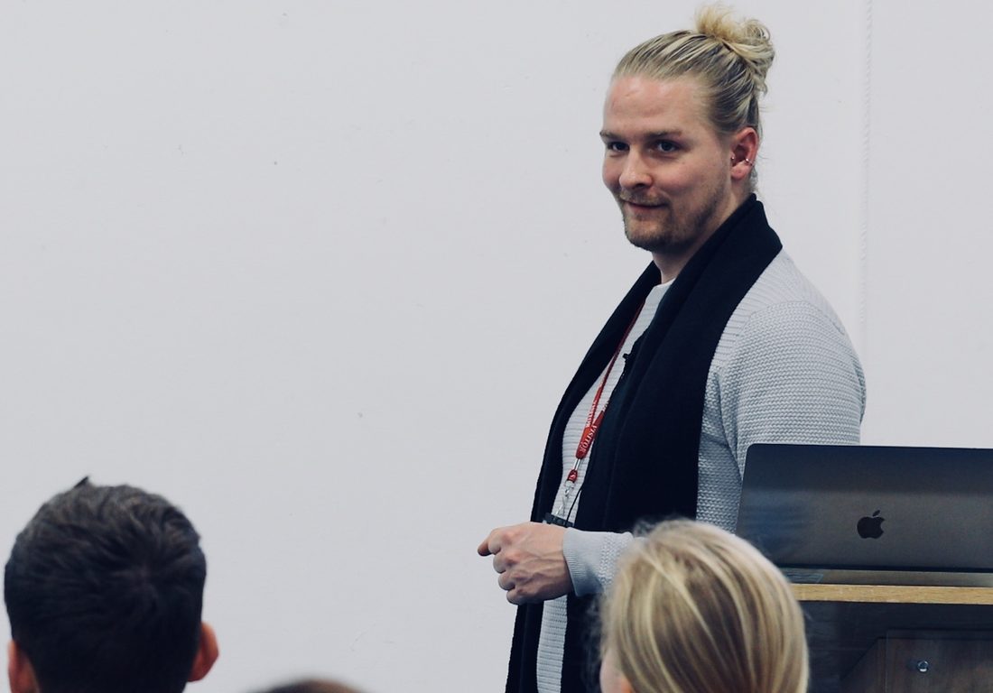 Luke speaking to a room of practitioners