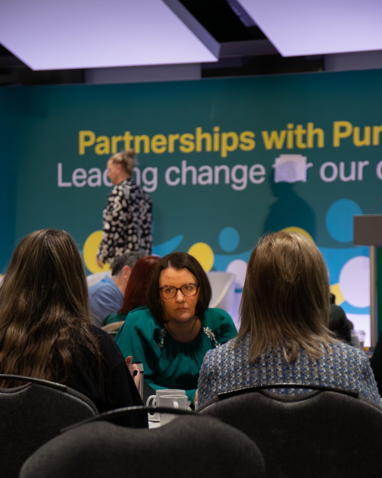Delegates discussing at a table